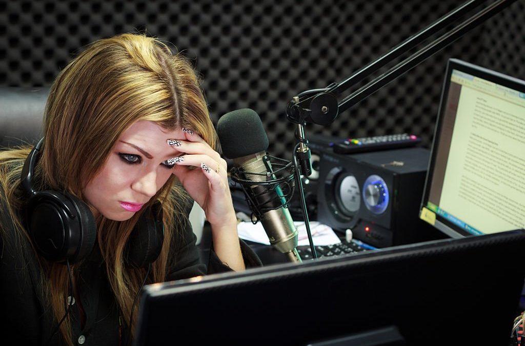 Woman serious facing challenges while working in a recording studio